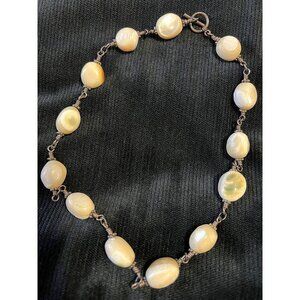 Shiva Eye Shell Necklace with sterling silver wire. Unique spherical beads.​